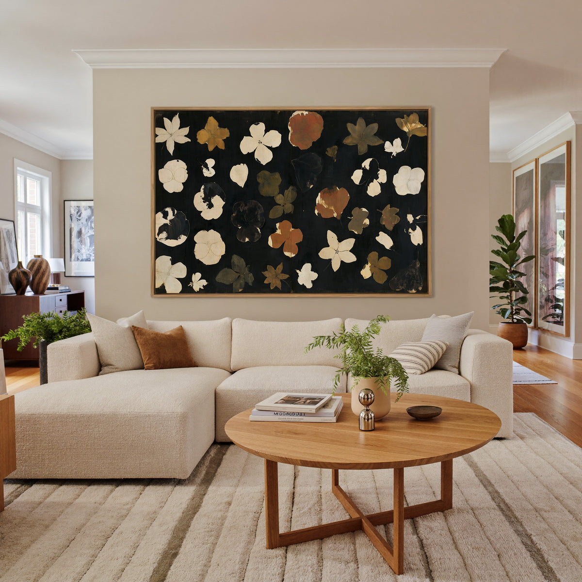 wild meadow flowers on a dark ground canvas wall art in an oak frame in a living room