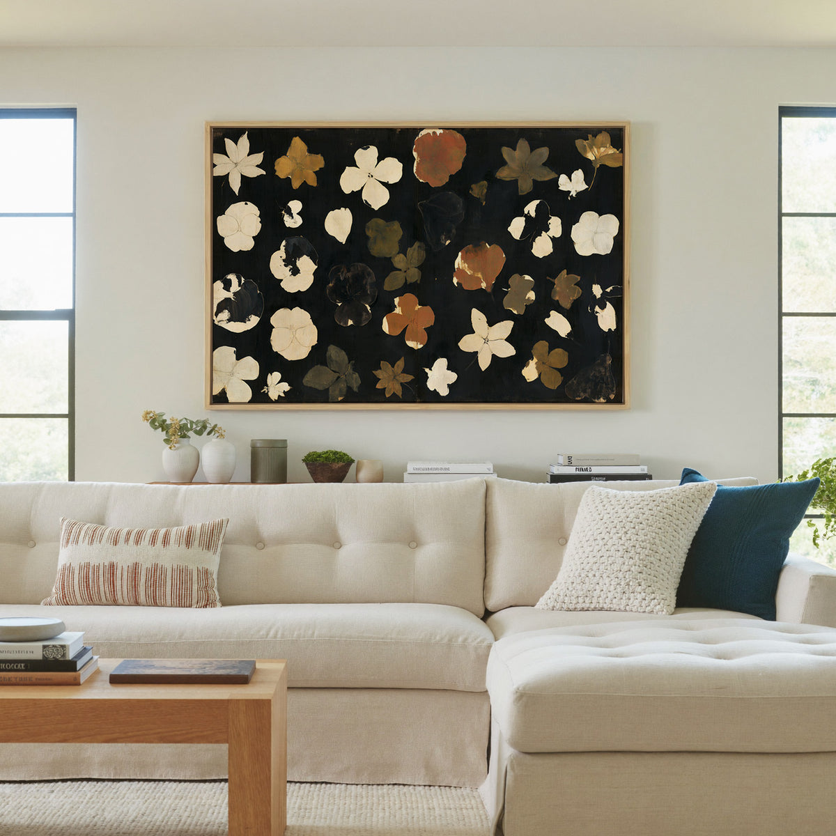 wild meadow flowers on a dark ground canvas wall art in a natural wood frame in a living room