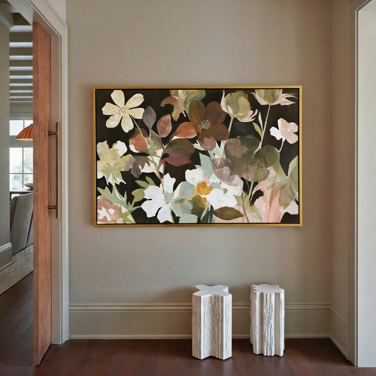 wild meadow flowers on a dark ground canvas wall art in a gold frame in a styled room setting