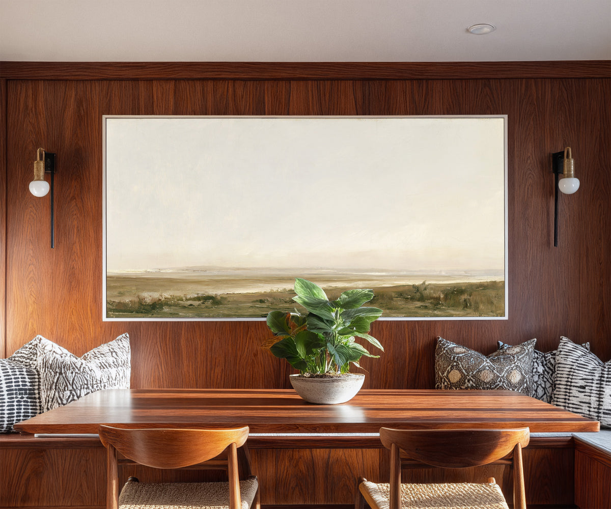 pale coastal landscape with low marshy ground canvas wall art in a white frame in a styled room setting
