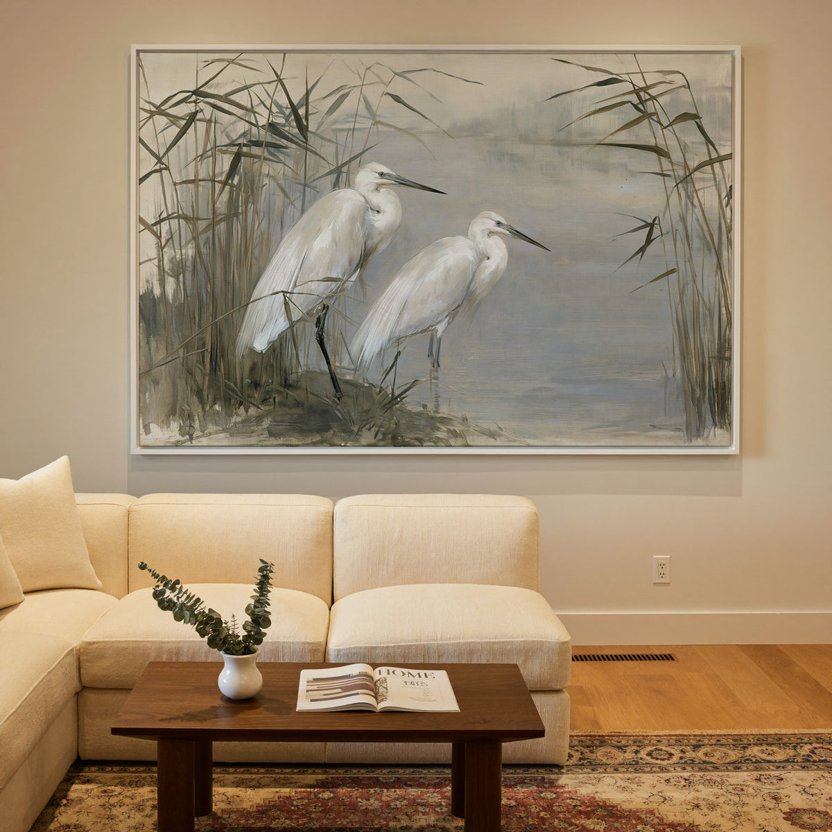 pair of white herons among tall reeds canvas wall art in a white frame in a styled room setting