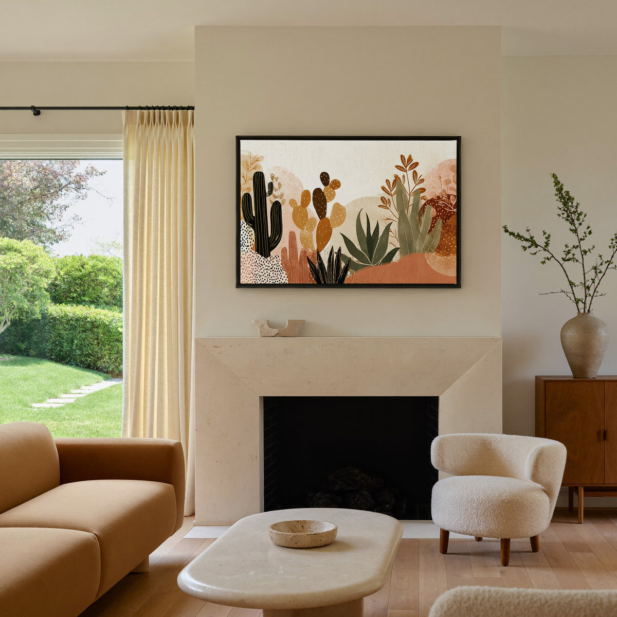 whimsical desert flora with cacti and aloe in canvas wall art in a black frame above a mantel