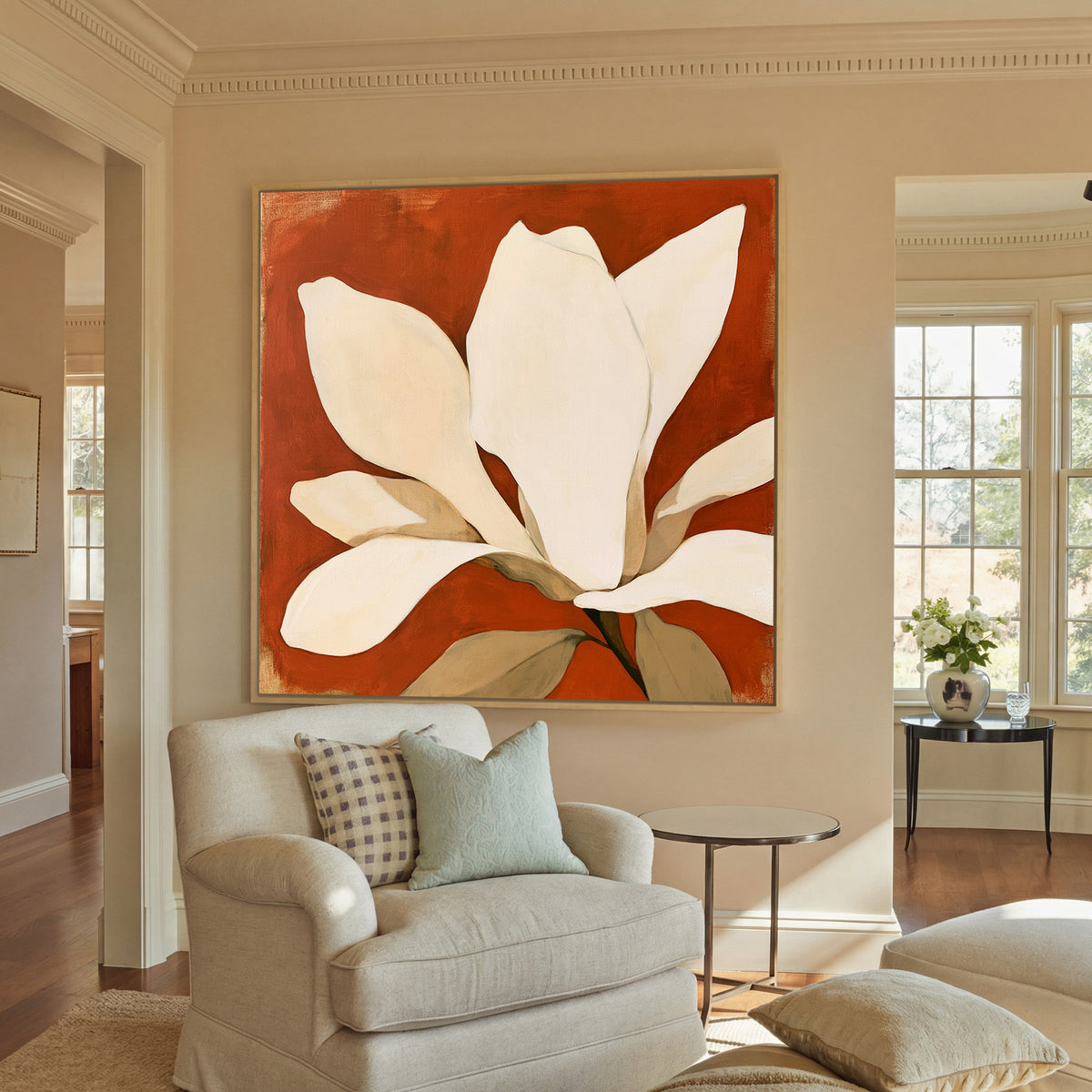 oversized ivory magnolia against canvas wall art in a natural floater frame in a styled room setting