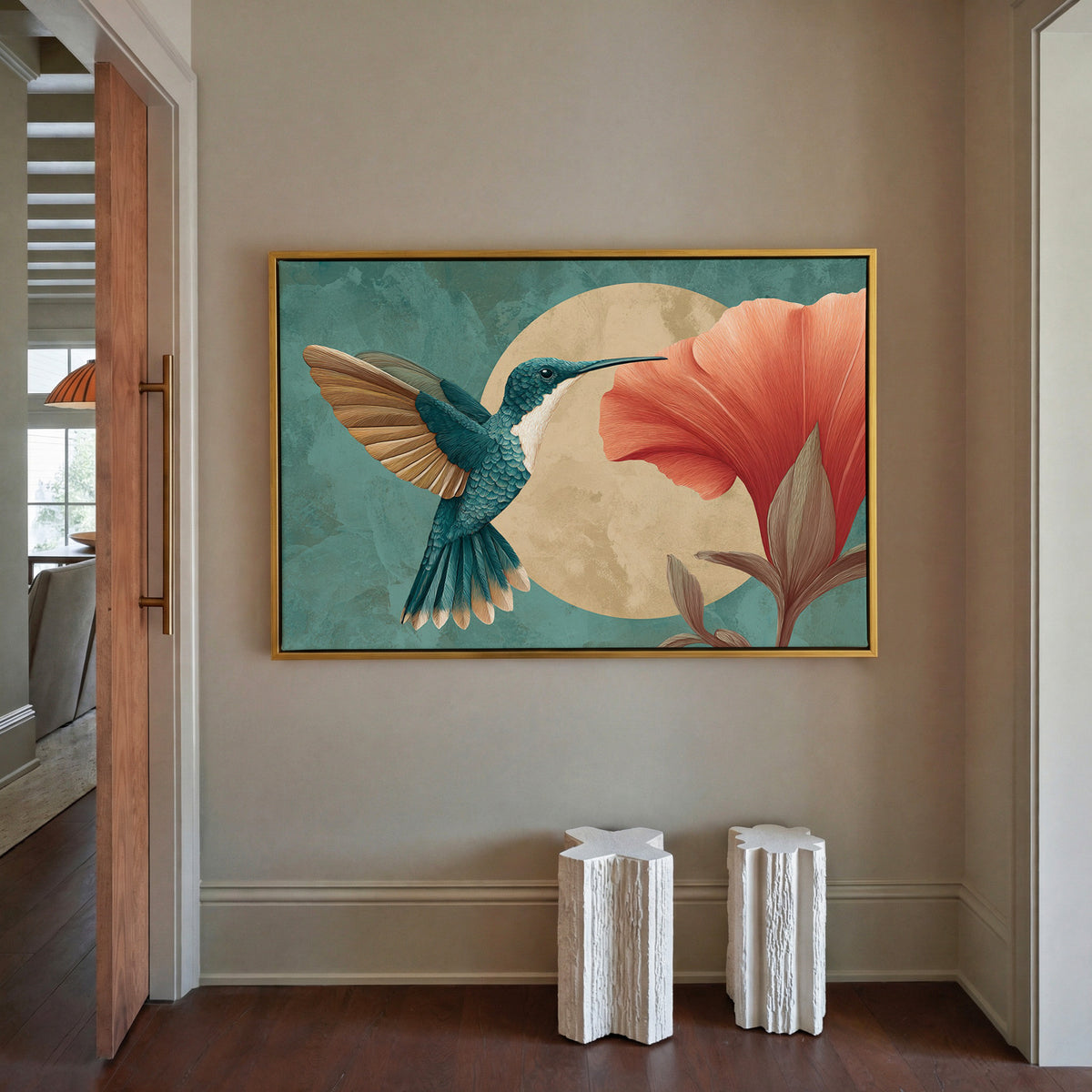 teal hummingbird beside an oversized coral canvas wall art in a gold floater frame in a styled room setting