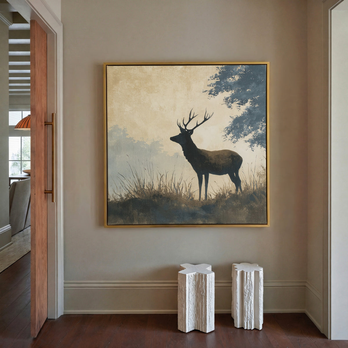 stag in profile beneath blue gray woodland canvas wall art in a gold floater frame in a styled room setting