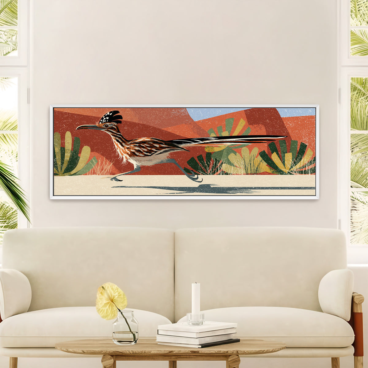 long tailed roadrunner crossing terracotta canvas wall art in a white floater frame in a styled room setting