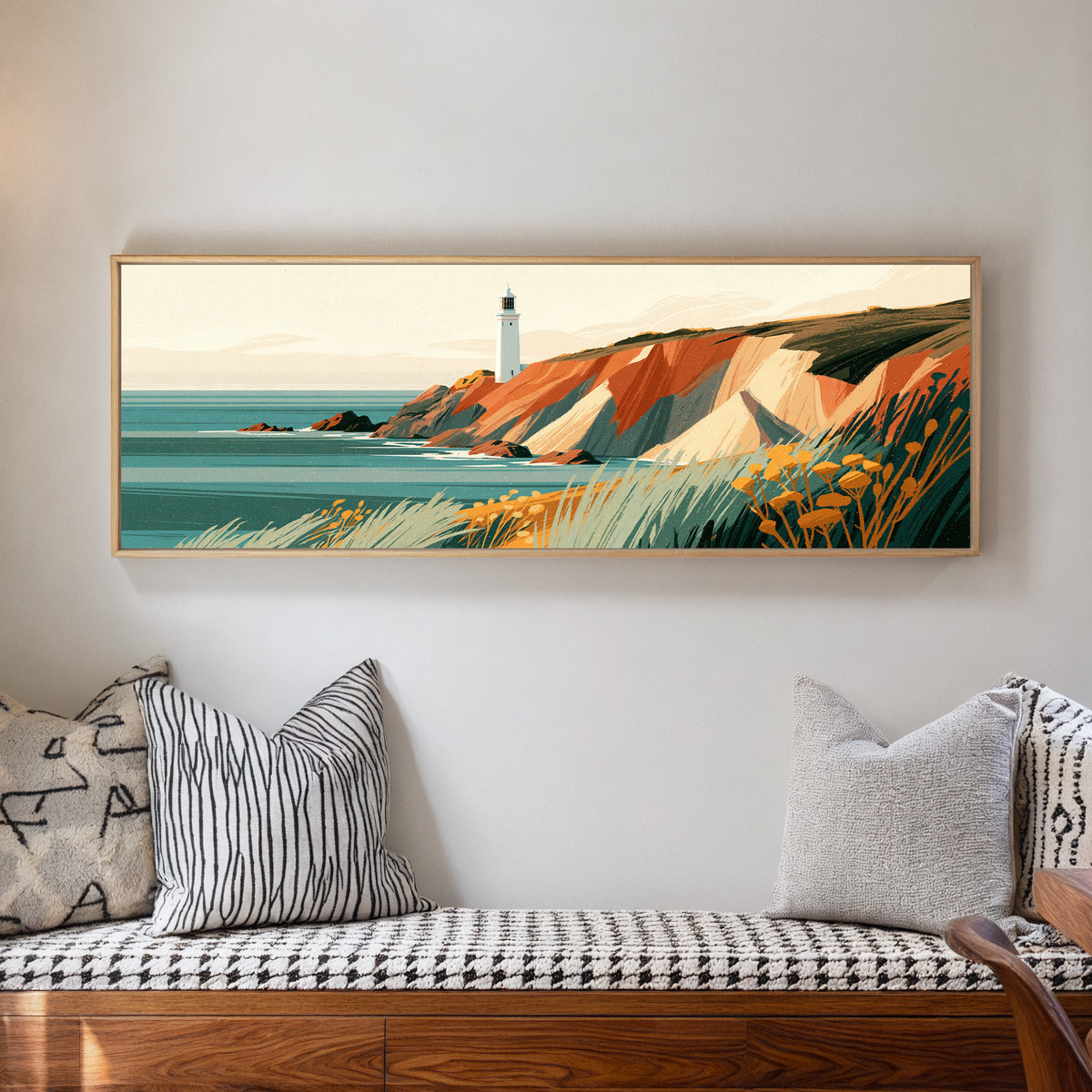 white lighthouse above rust colored cliffs and canvas wall art in a natural floater frame in a living room