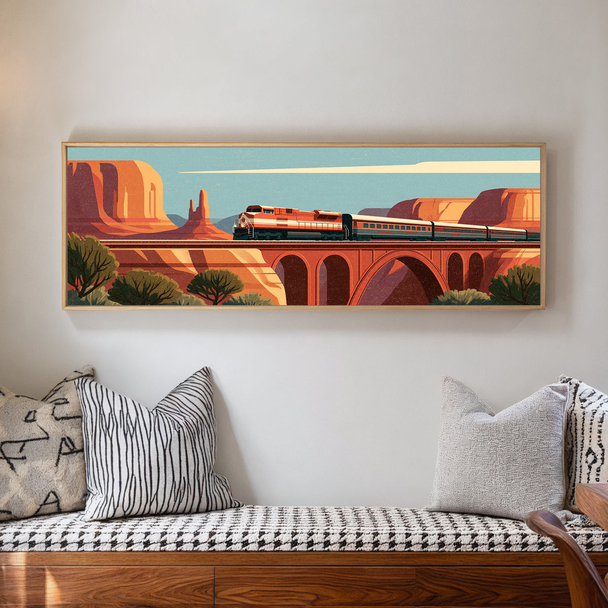 red and cream passenger train crossing an canvas wall art in a natural floater frame in a living room
