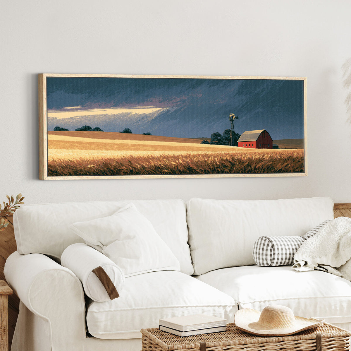 red barn and windmill across canvas wall art in an oak finish floater frame in a styled room setting