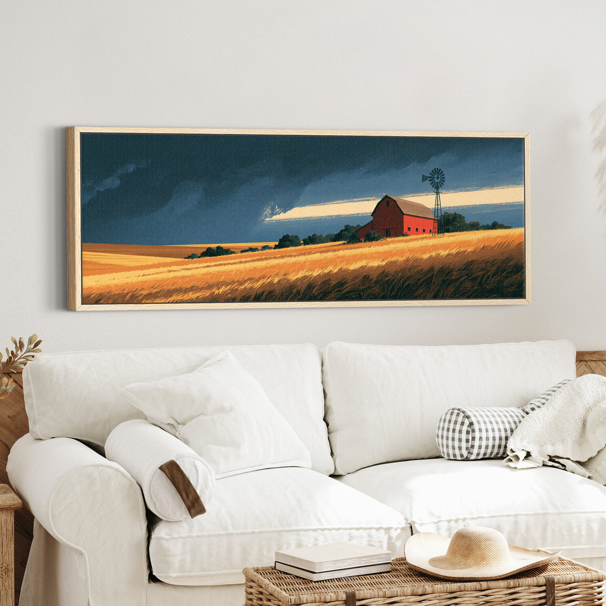 red barn and windmill above canvas wall art in an oak finish floater frame in a styled room setting