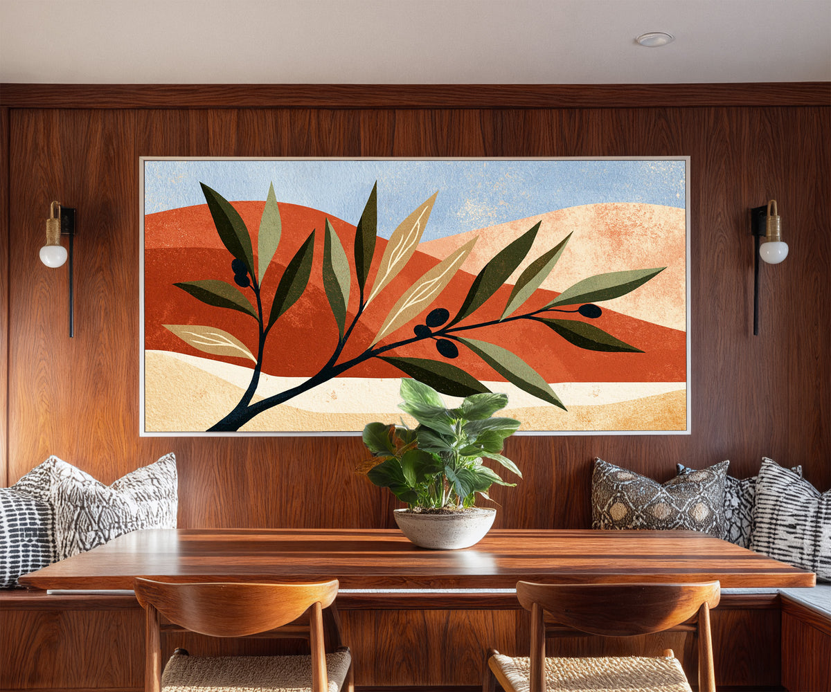 olive branch against terracotta canvas wall art in a white floater frame in a styled room setting