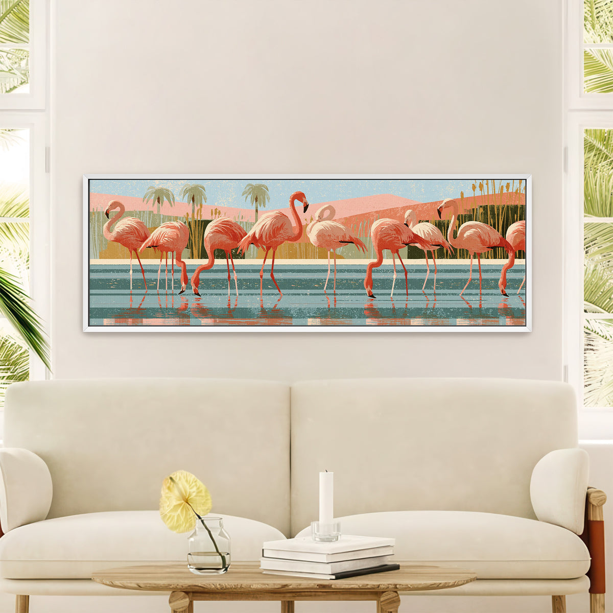 coral pink flamingos wading in striped teal canvas wall art in a white floater frame in a styled room setting