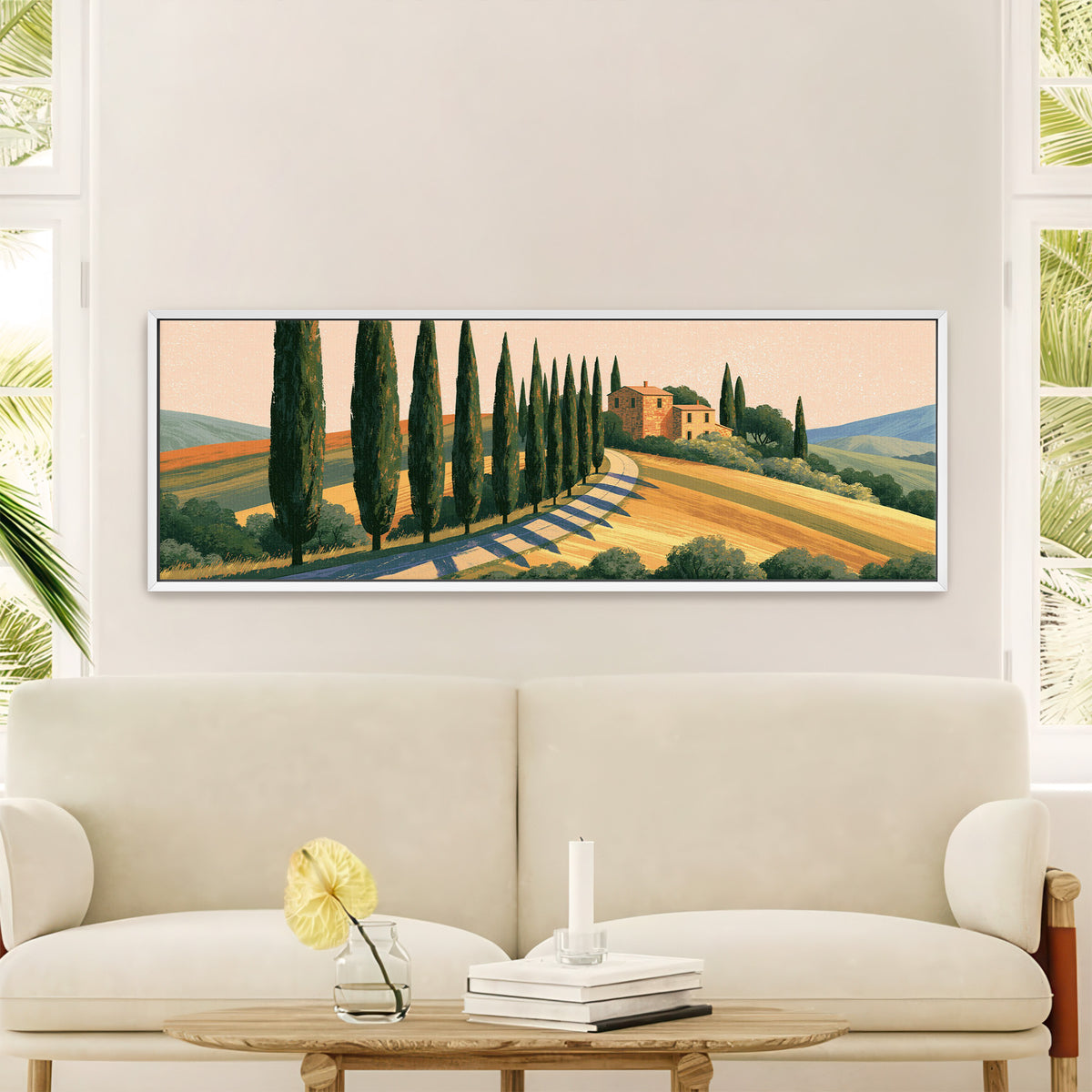 winding country road lined with canvas wall art in a white floater frame in a styled room setting