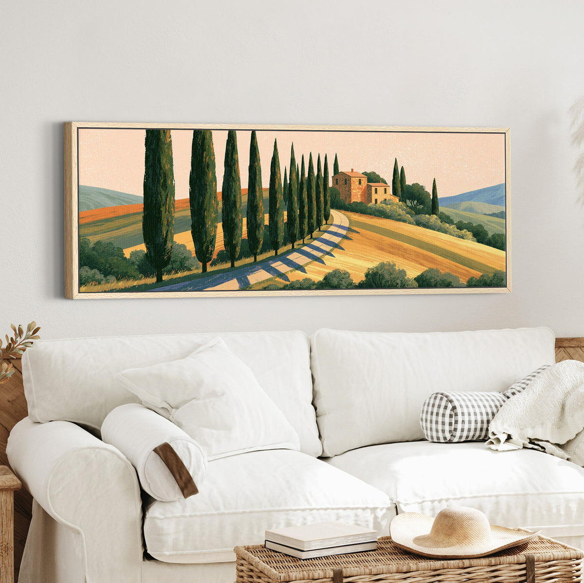 winding country road lined with canvas wall art in an oak finish floater frame in a styled room setting