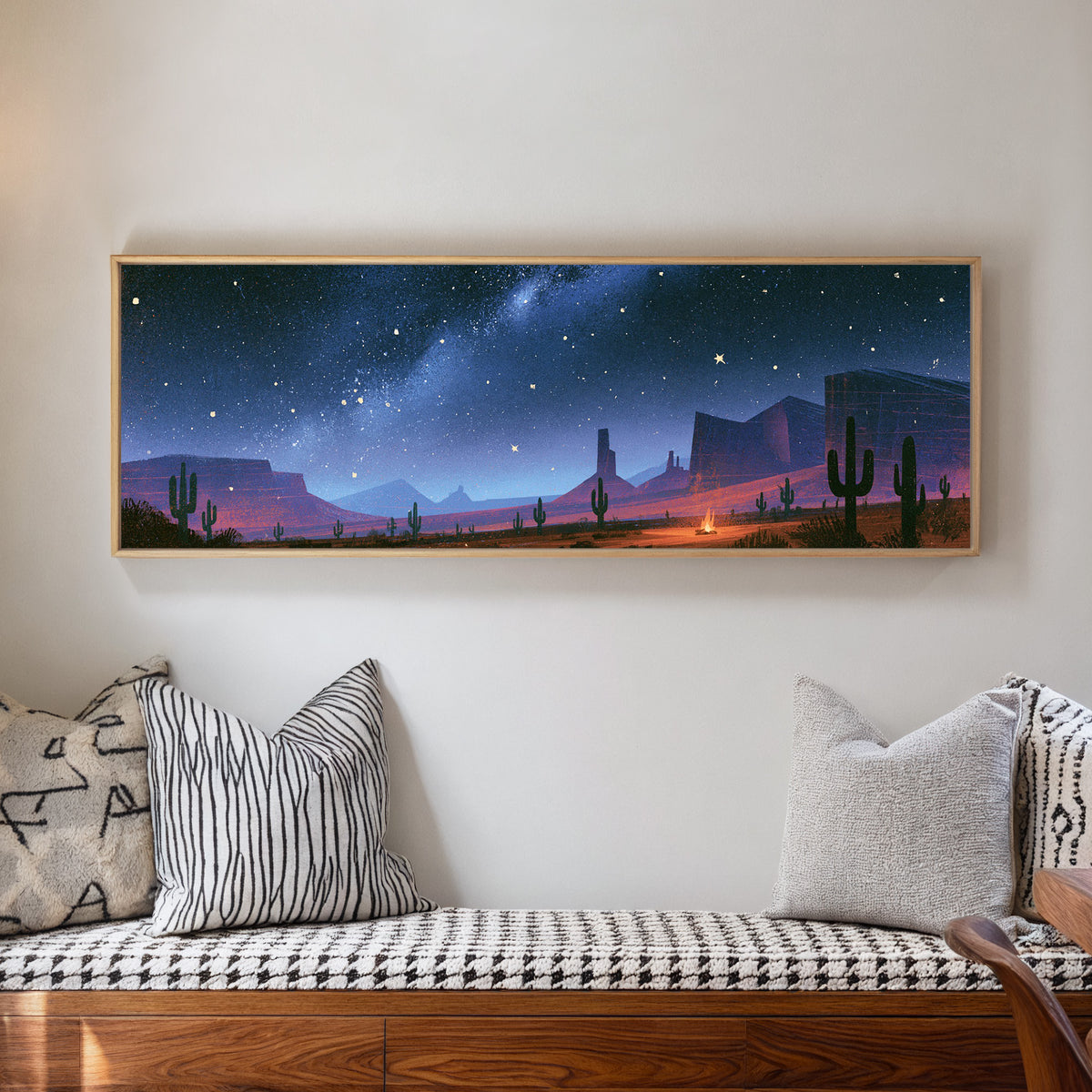 star filled blue sky above desert mesas, cactus canvas wall art in a natural floater frame in a living room