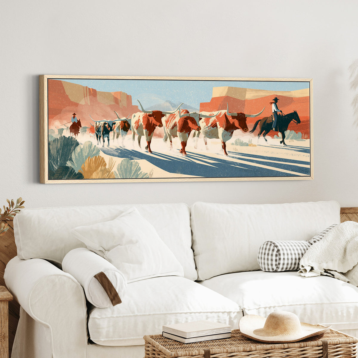 longhorn cattle and mounted canvas wall art in an oak finish floater frame in a styled room setting