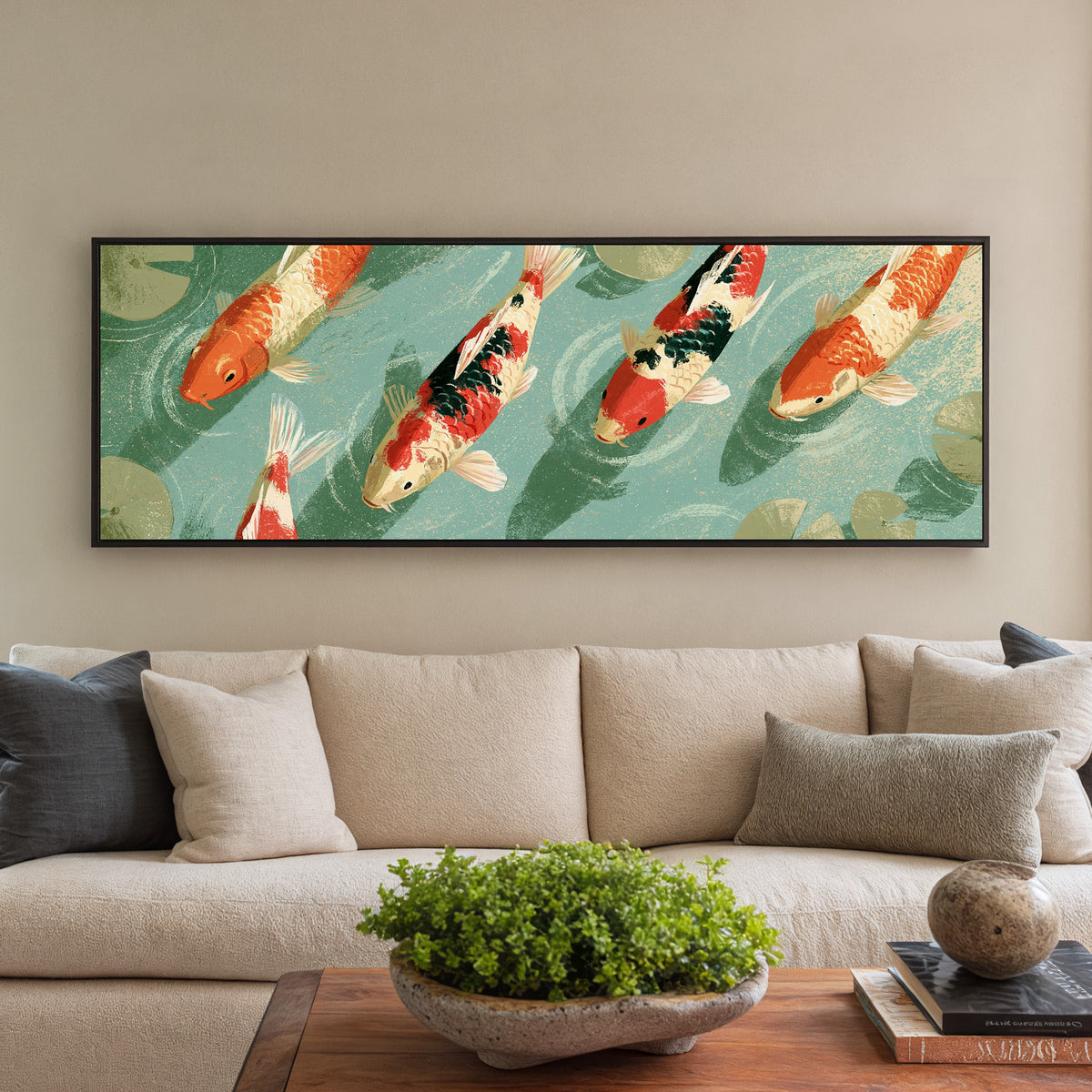red and cream koi crossing teal water beside canvas wall art in a black floater frame in a styled room setting