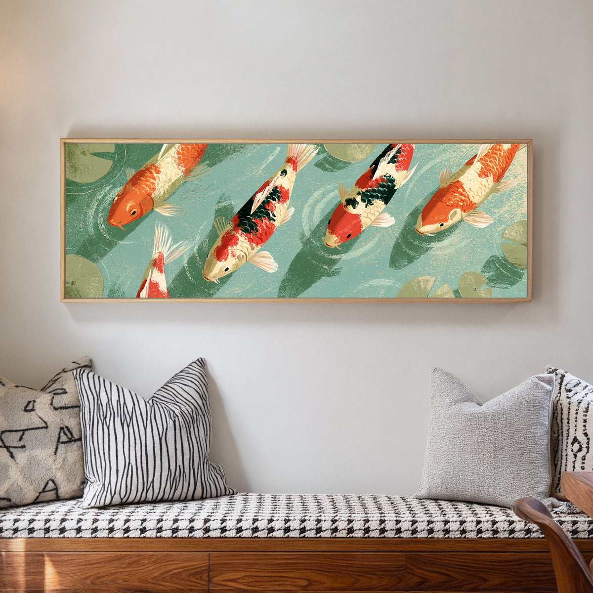 red and cream koi crossing teal water beside canvas wall art in a natural floater frame in a living room