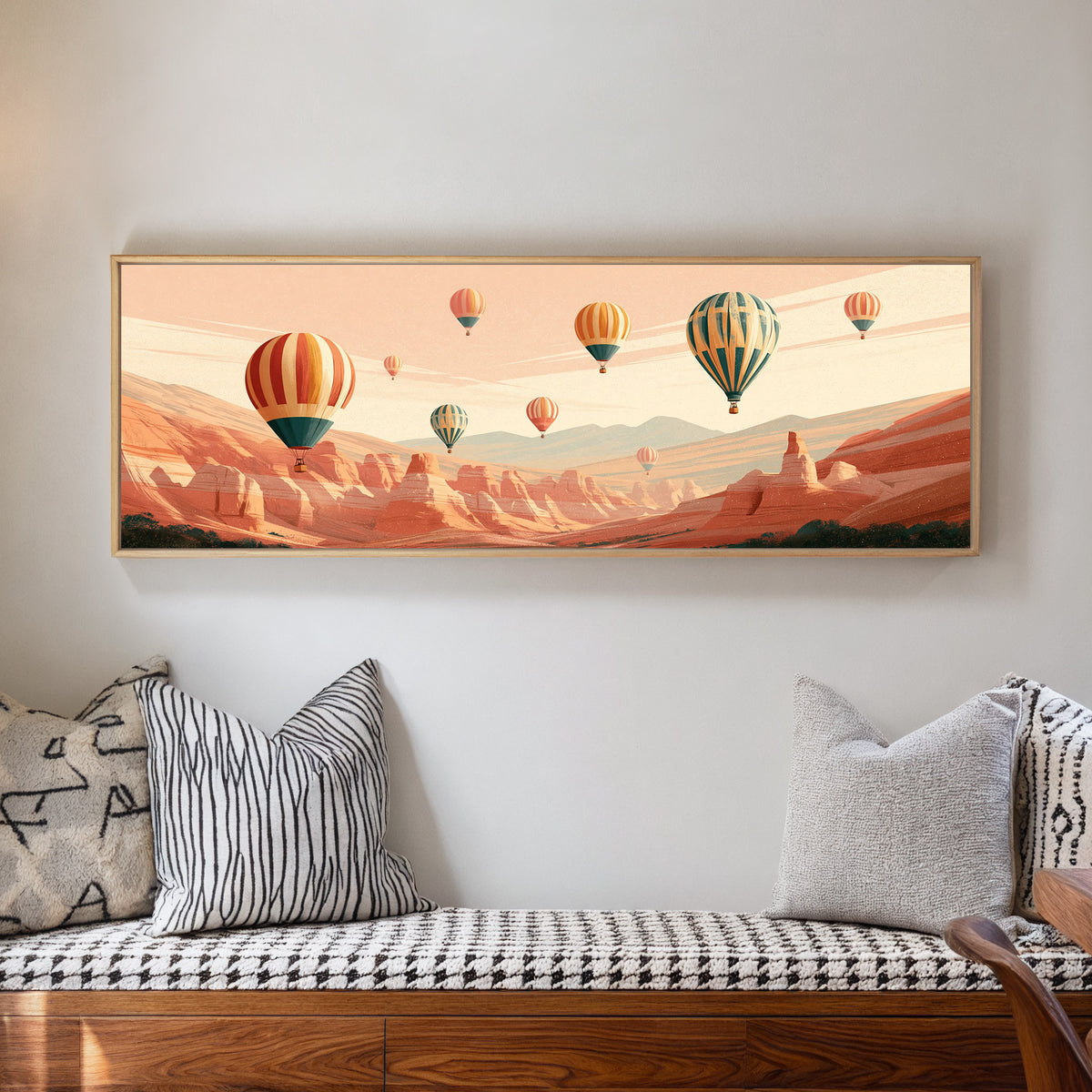 striped hot air balloons above a terracotta canvas wall art in a natural floater frame in a living room