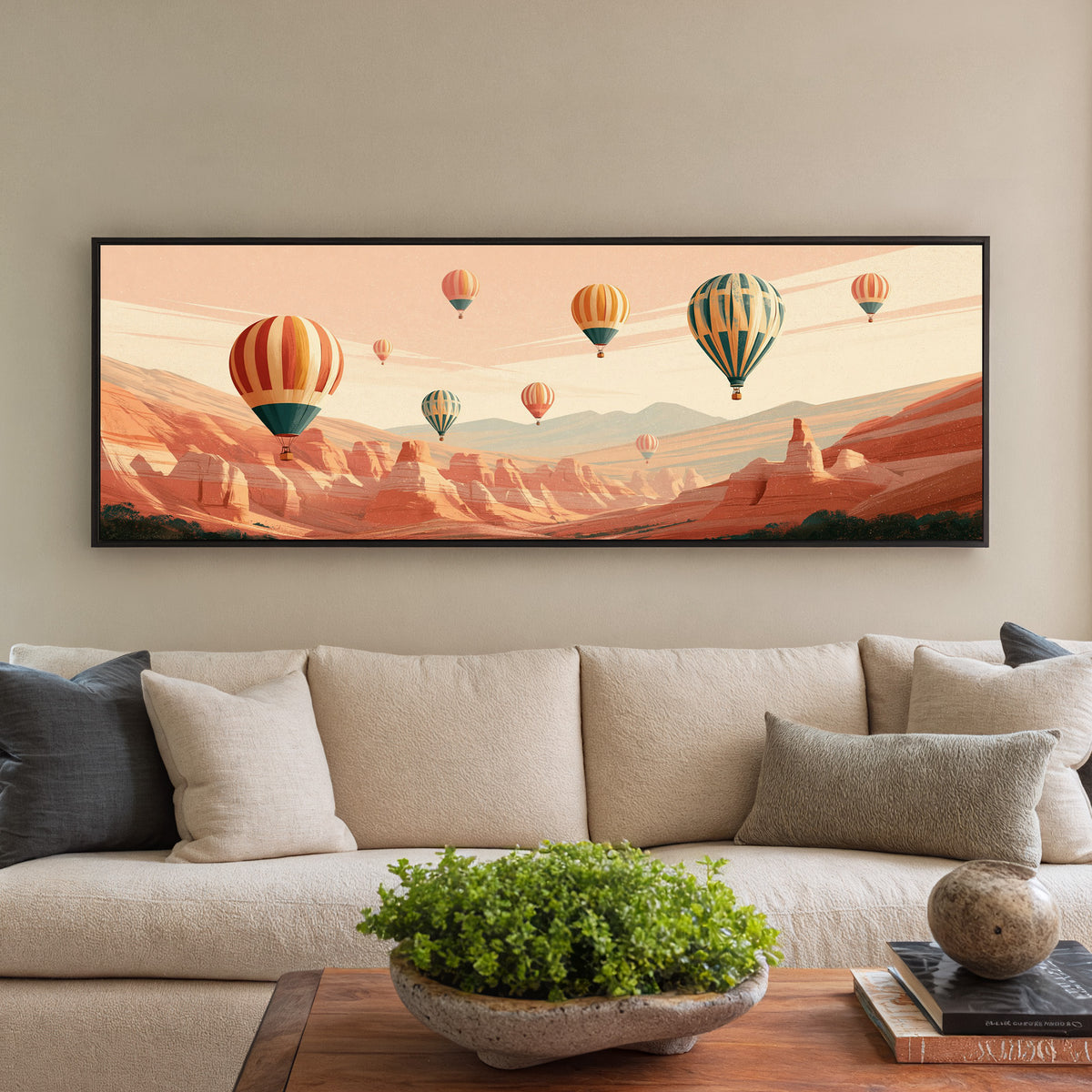 striped hot air balloons above a terracotta canvas wall art in a black floater frame in a styled room setting