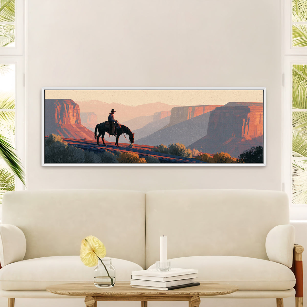 lone mounted cowboy above terracotta canyon canvas wall art in a white floater frame in a styled room setting
