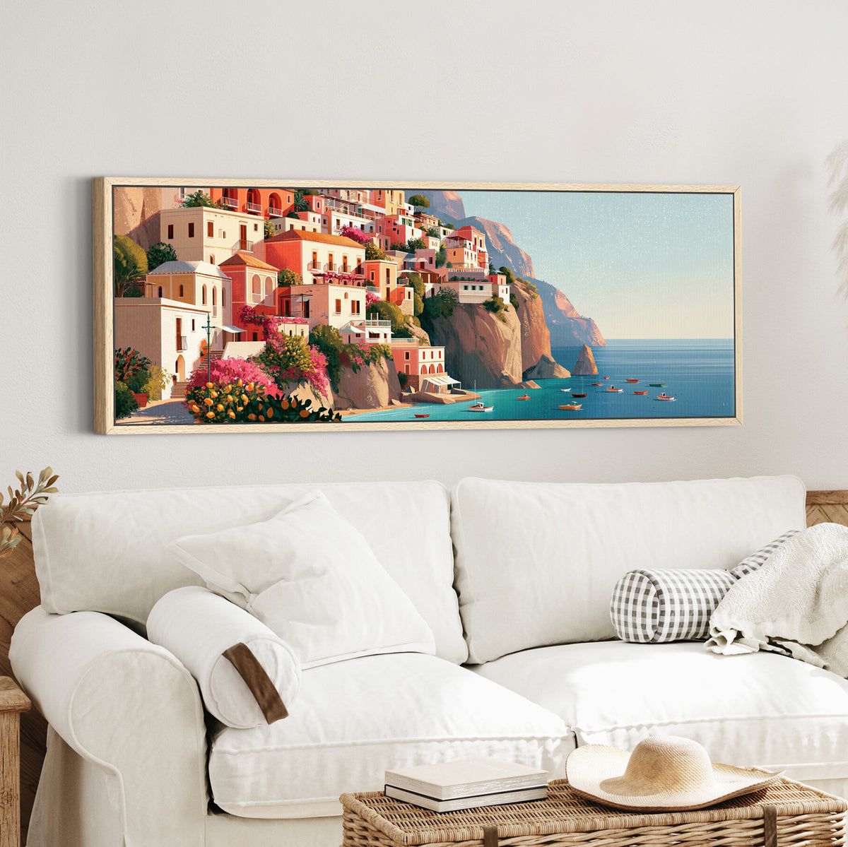 coral cliffside houses above canvas wall art in an oak finish floater frame in a styled room setting