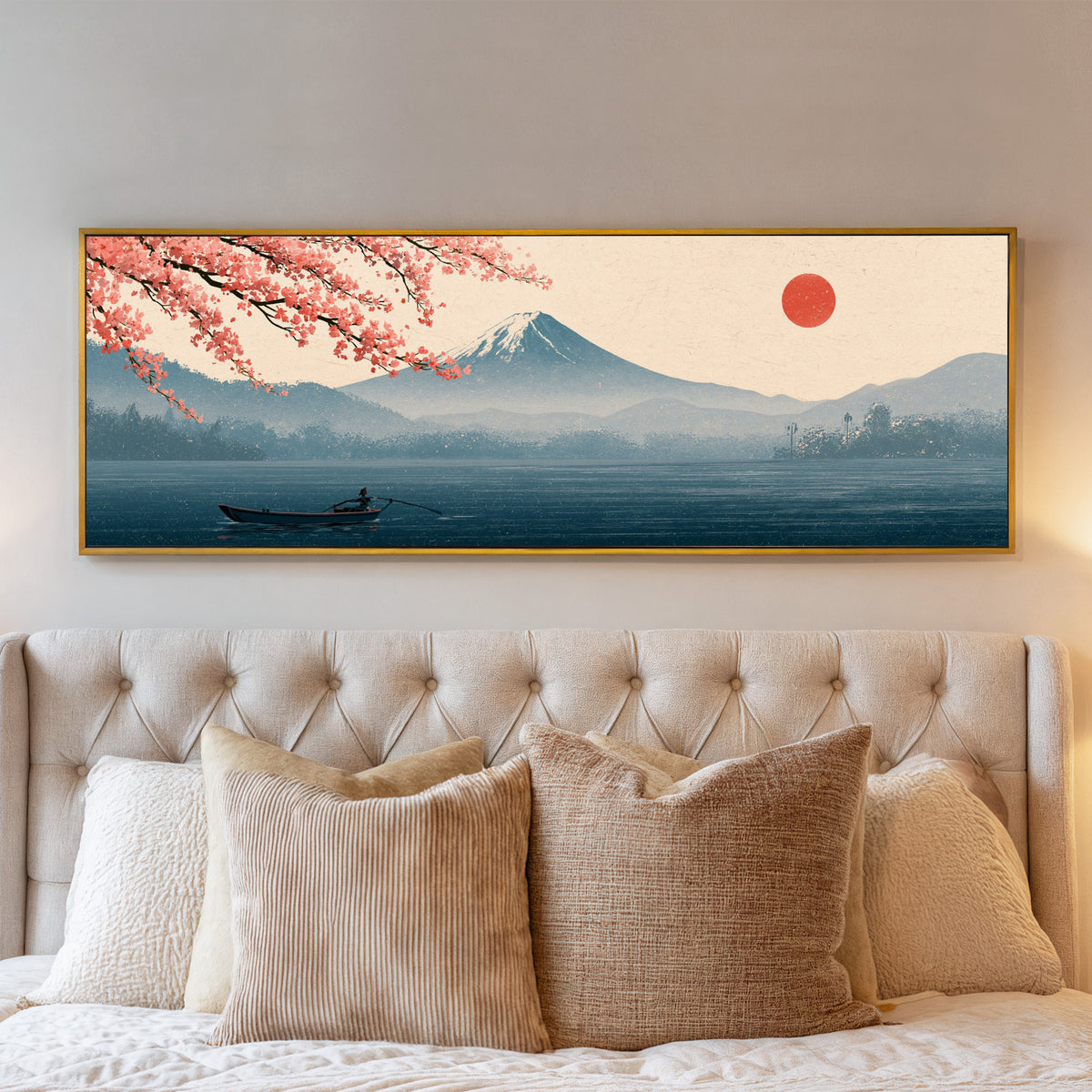 mount fuji above a blue lake with coral cherry canvas wall art in a gold floater frame above a bed