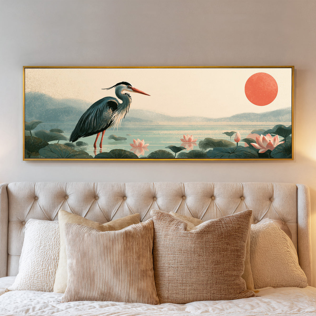 blue gray heron among pink lotus flowers canvas wall art in a gold floater frame above a bed