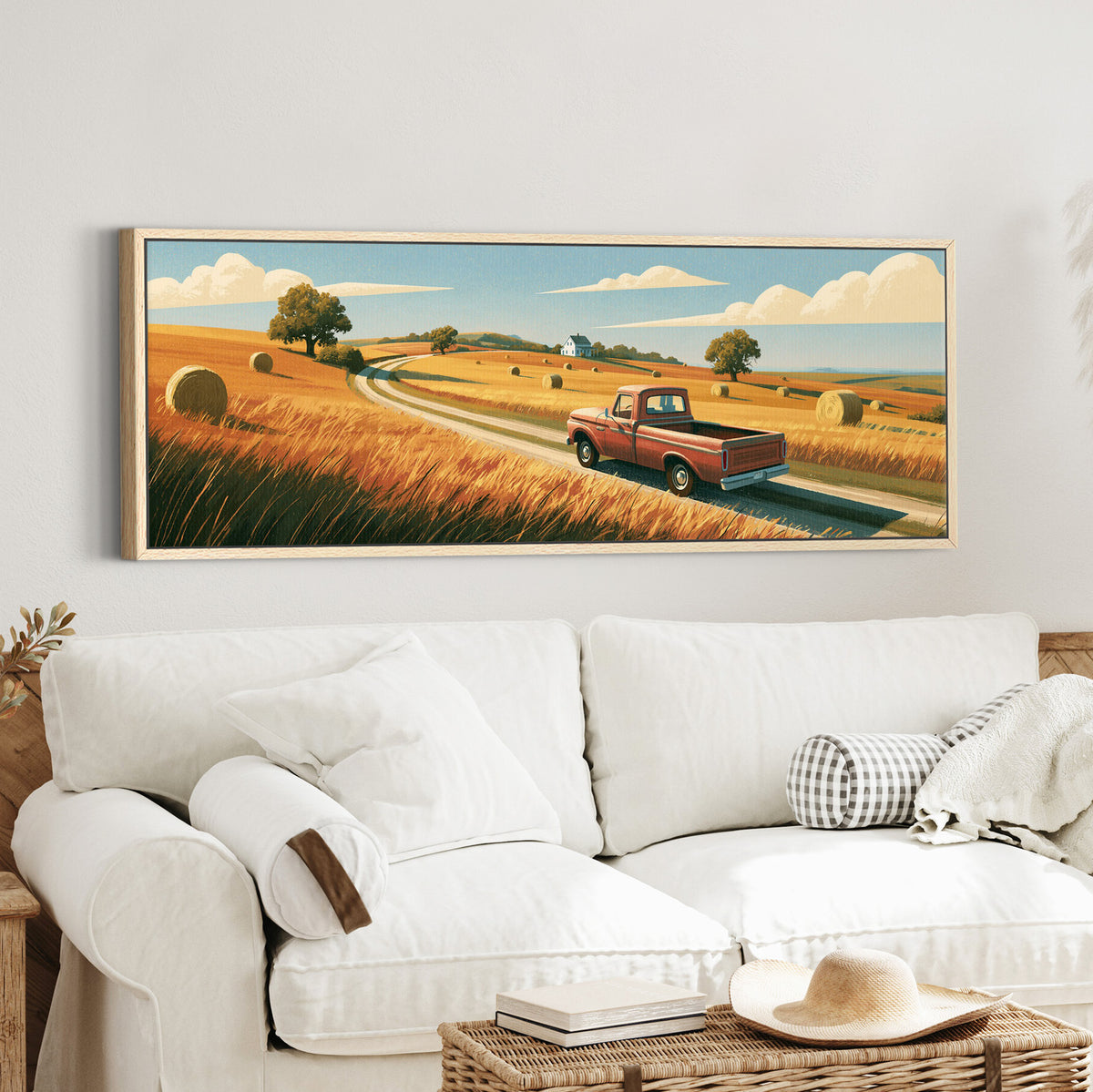 red pickup on a winding road canvas wall art in an oak finish floater frame in a styled room setting