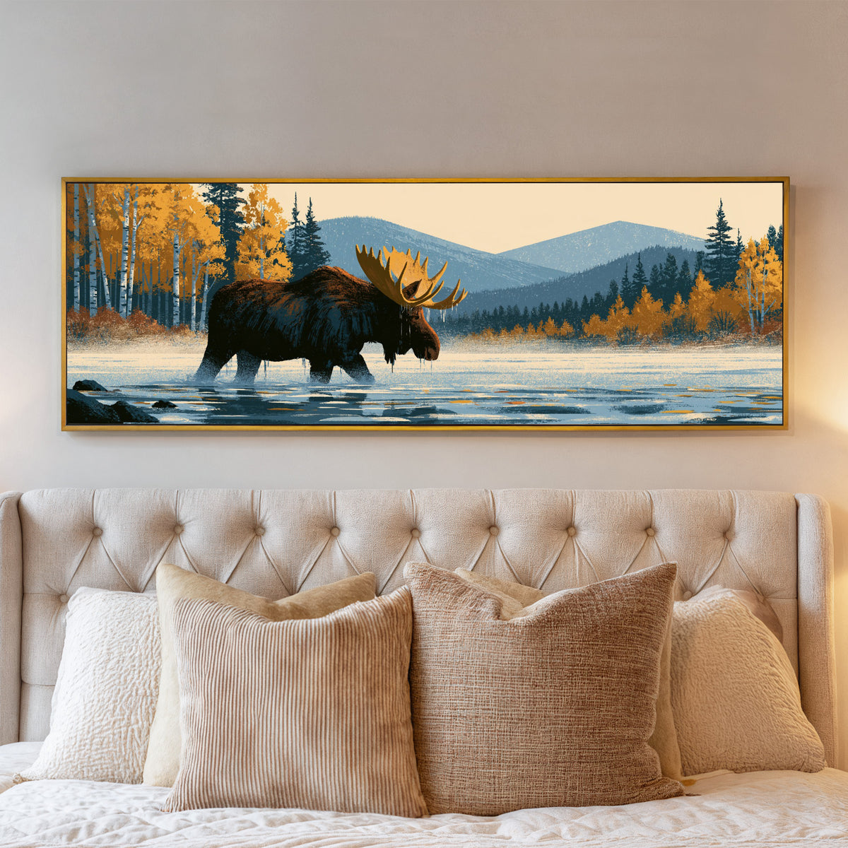 wading moose beneath golden foliage and blue canvas wall art in a gold floater frame above a bed