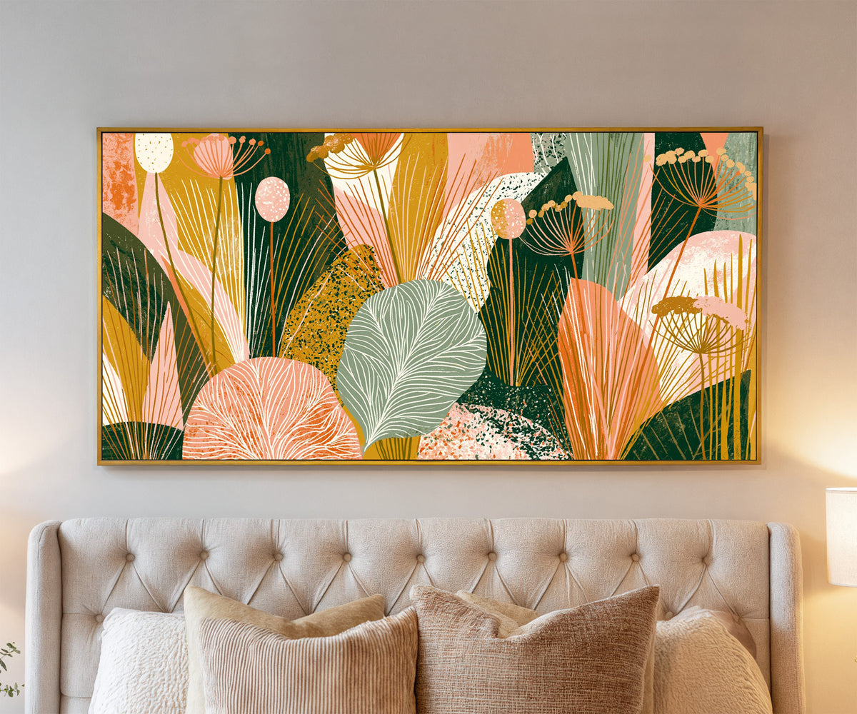 coral and green leaves with fine veins and fan canvas wall art in a gold floater frame above a bed