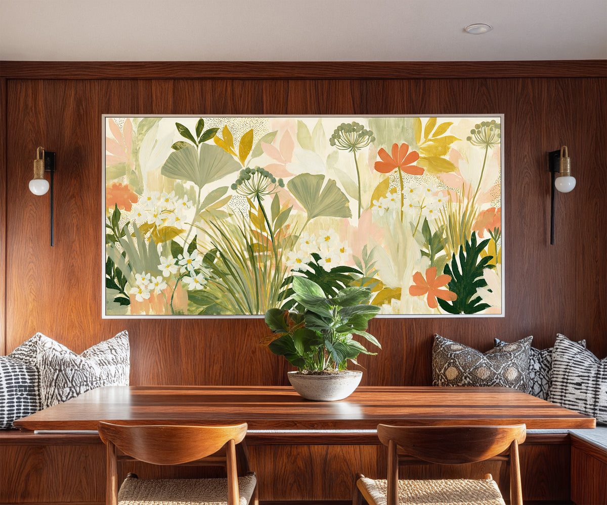 white daisies and coral flowers canvas wall art in a white floater frame in a styled room setting