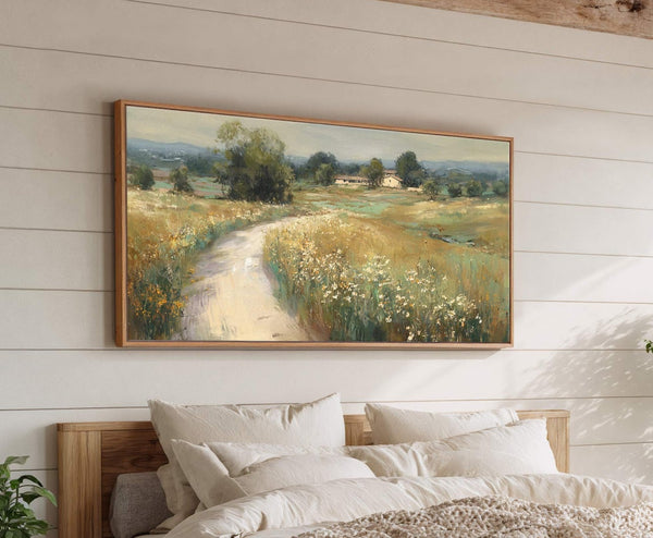 This horizontal landscape painting print features a winding dirt road through a meadow with scattered wildflowers and distant farmhouses, rendered in a loose, impressionistic style with earthy greens and yellows.