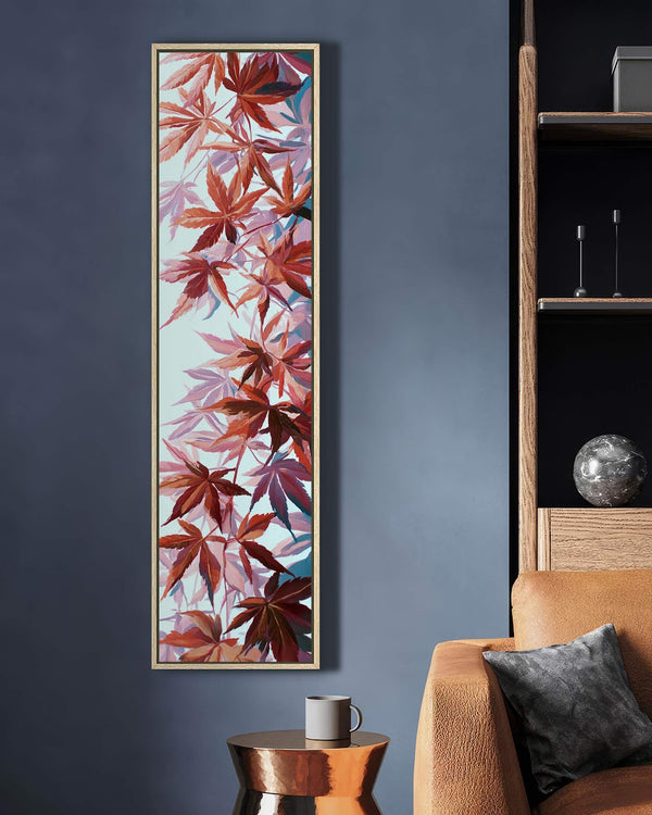 Vertical canvas wall art in interior setting.