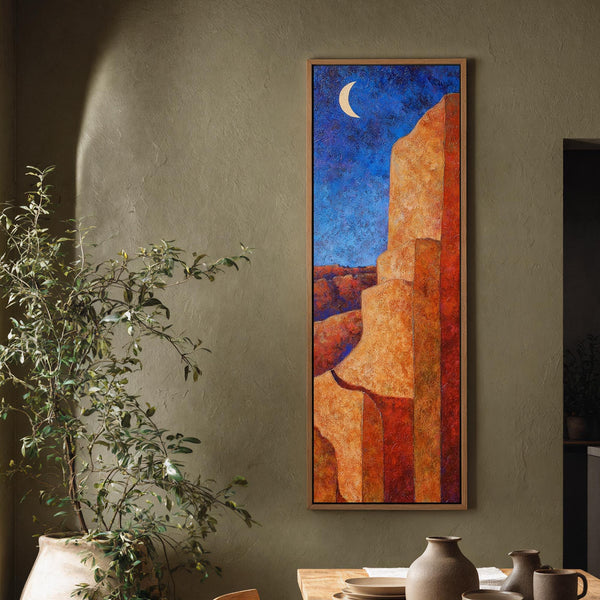 Vertical canvas wall art in interior setting.