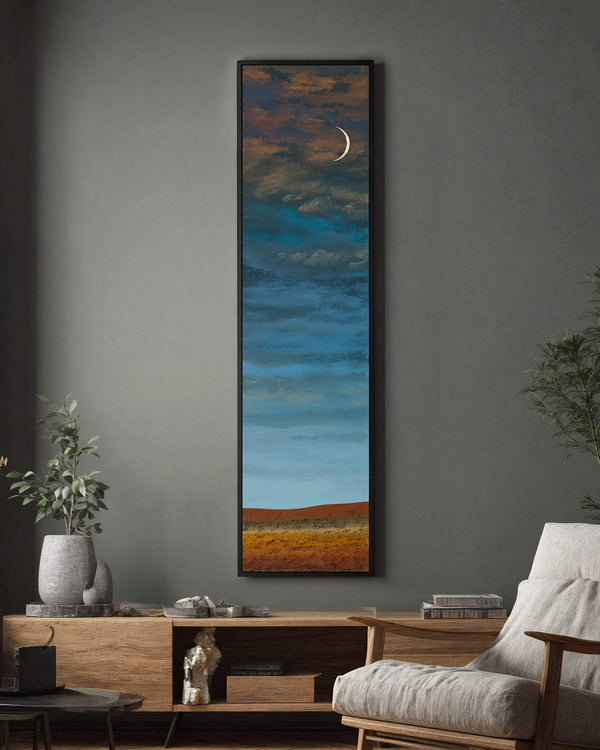 Vertical canvas wall art in interior setting.