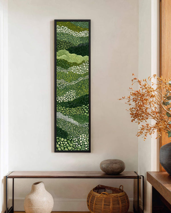 Vertical canvas wall art in interior setting.