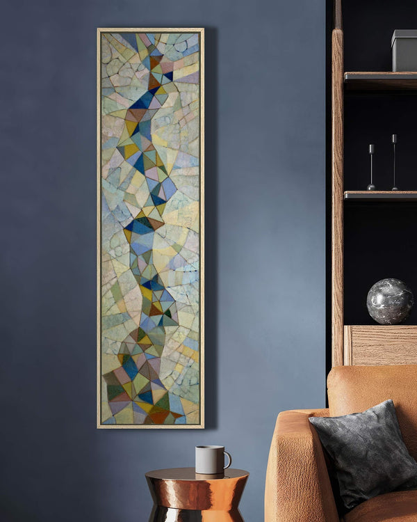 Vertical canvas wall art in interior setting.