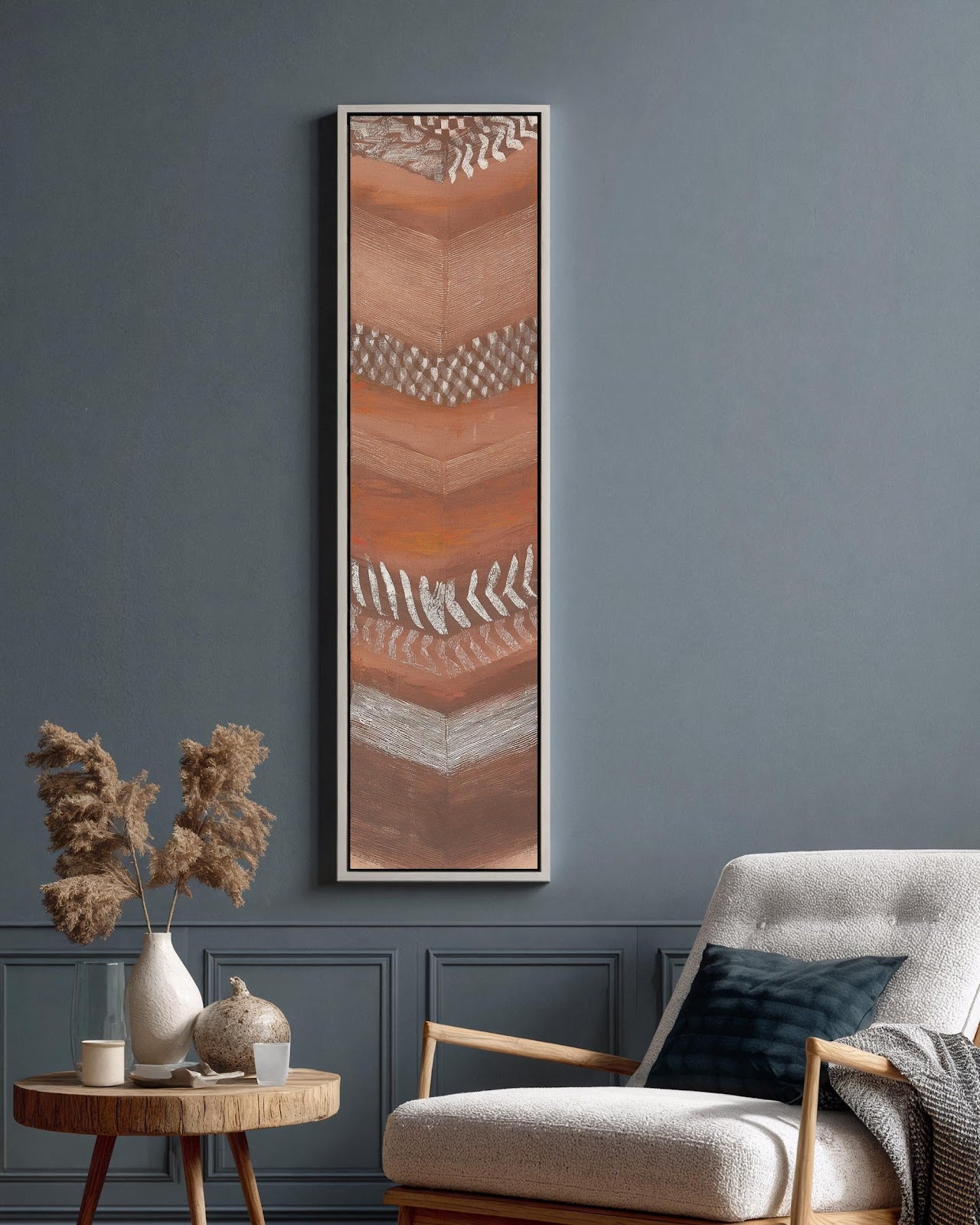 Vertical canvas wall art in interior setting.