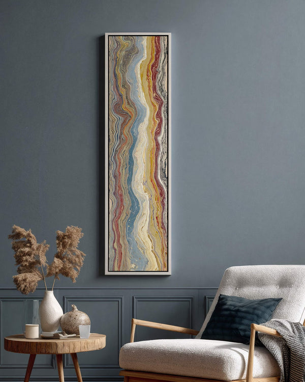Vertical canvas wall art in interior setting.
