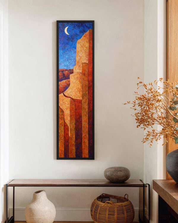Vertical canvas wall art in interior setting.