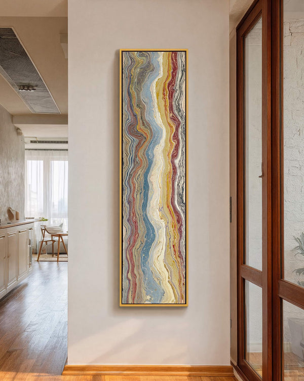 Vertical canvas wall art in interior setting.