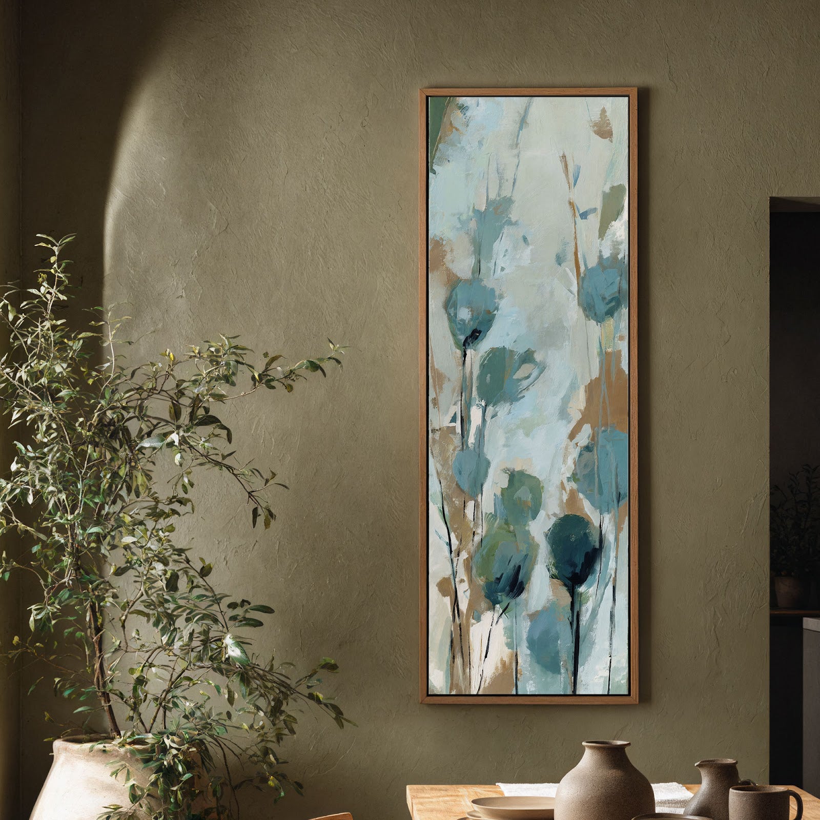 Teal impressionistic wildflower canvas print in natural floating frame on olive textured accent wall in minimalist entryway, tall botanical wall art
