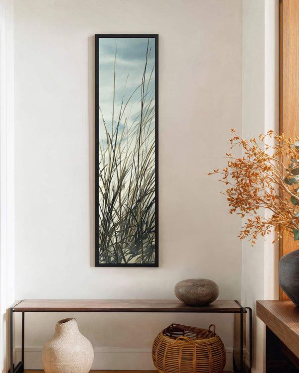 Vertical canvas wall art in interior setting.