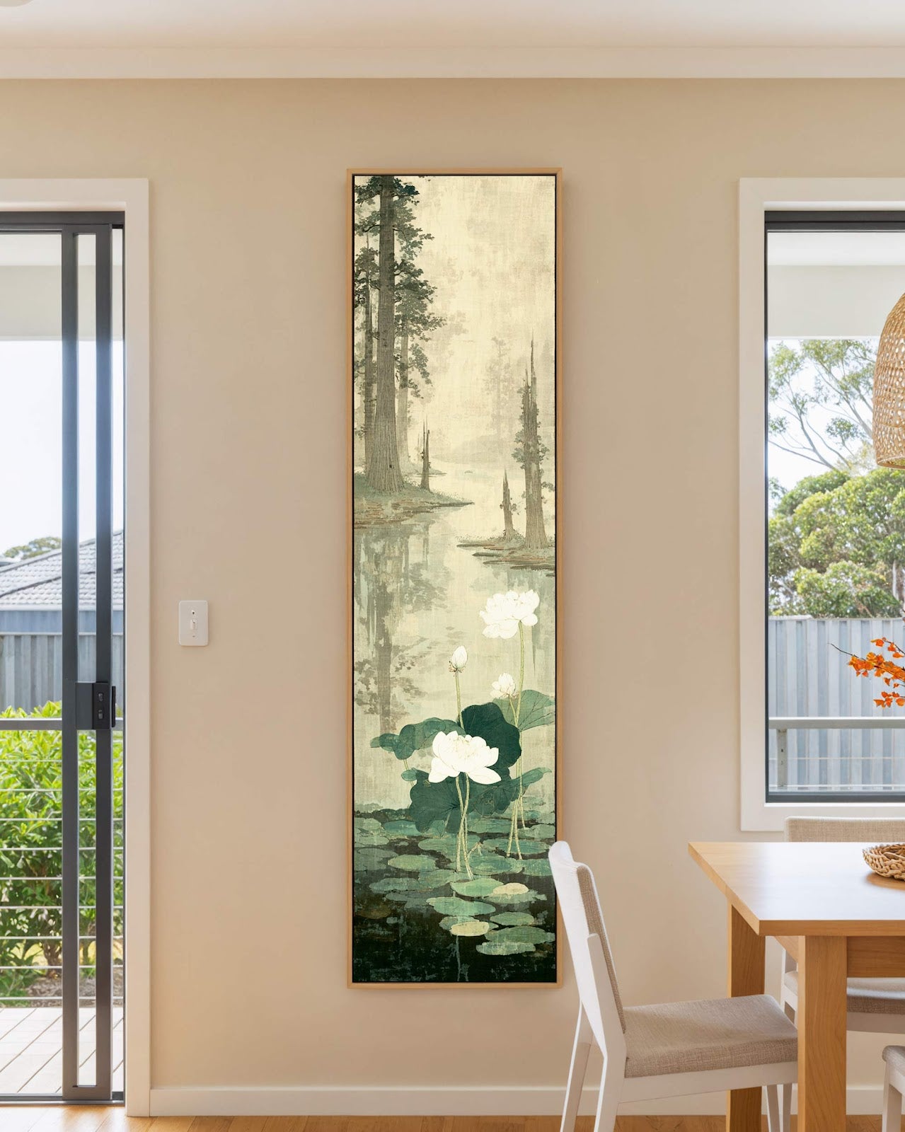 Vertical canvas wall art in interior setting.