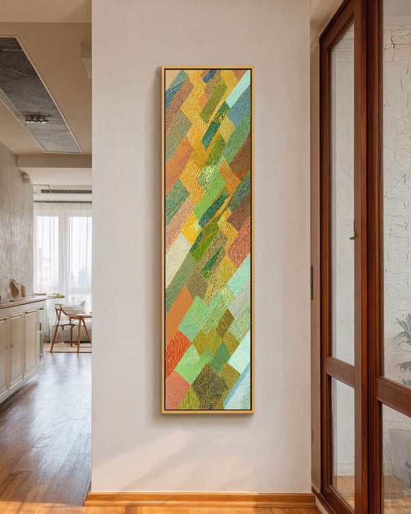 Vertical canvas wall art in interior setting.