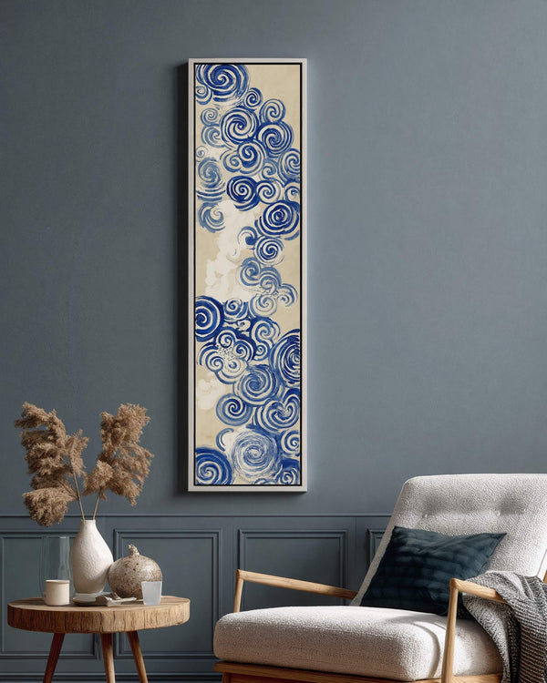 Vertical canvas wall art in interior setting.