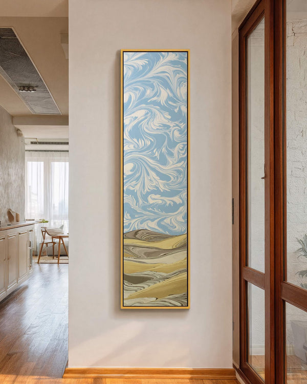 Vertical canvas wall art in interior setting.