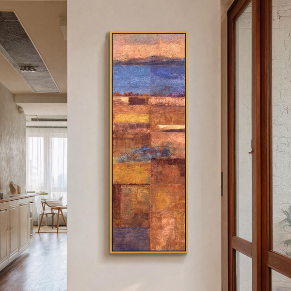 Vertical canvas wall art in interior setting.