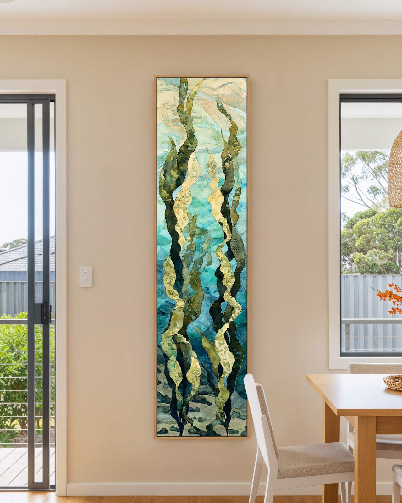 Vertical canvas wall art in interior setting.